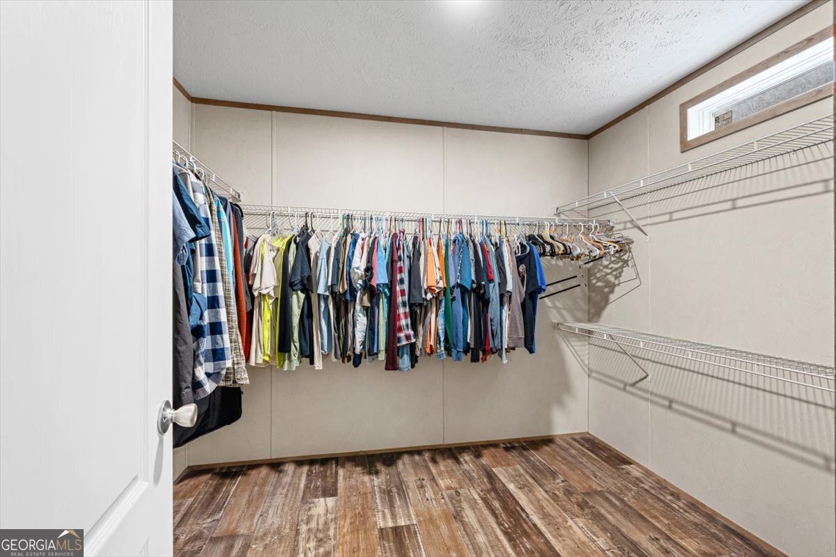 152 Campbell Road Cedartown, GA 30125 - Photo 29 of 42 a view of walk in closet with clothes and shoes