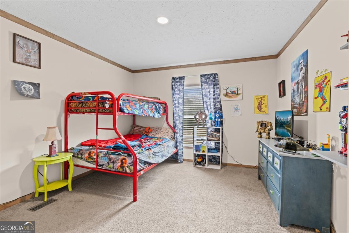 152 Campbell Road Cedartown, GA 30125 - Photo 30 of 42 a bedroom with a bed and a desk