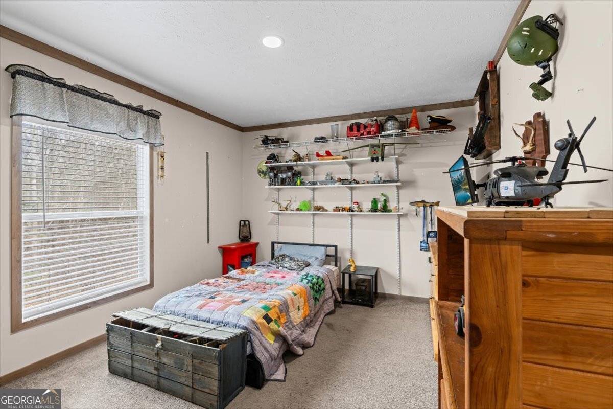 152 Campbell Road Cedartown, GA 30125 - Photo 31 of 42 a bedroom with a bed and a window