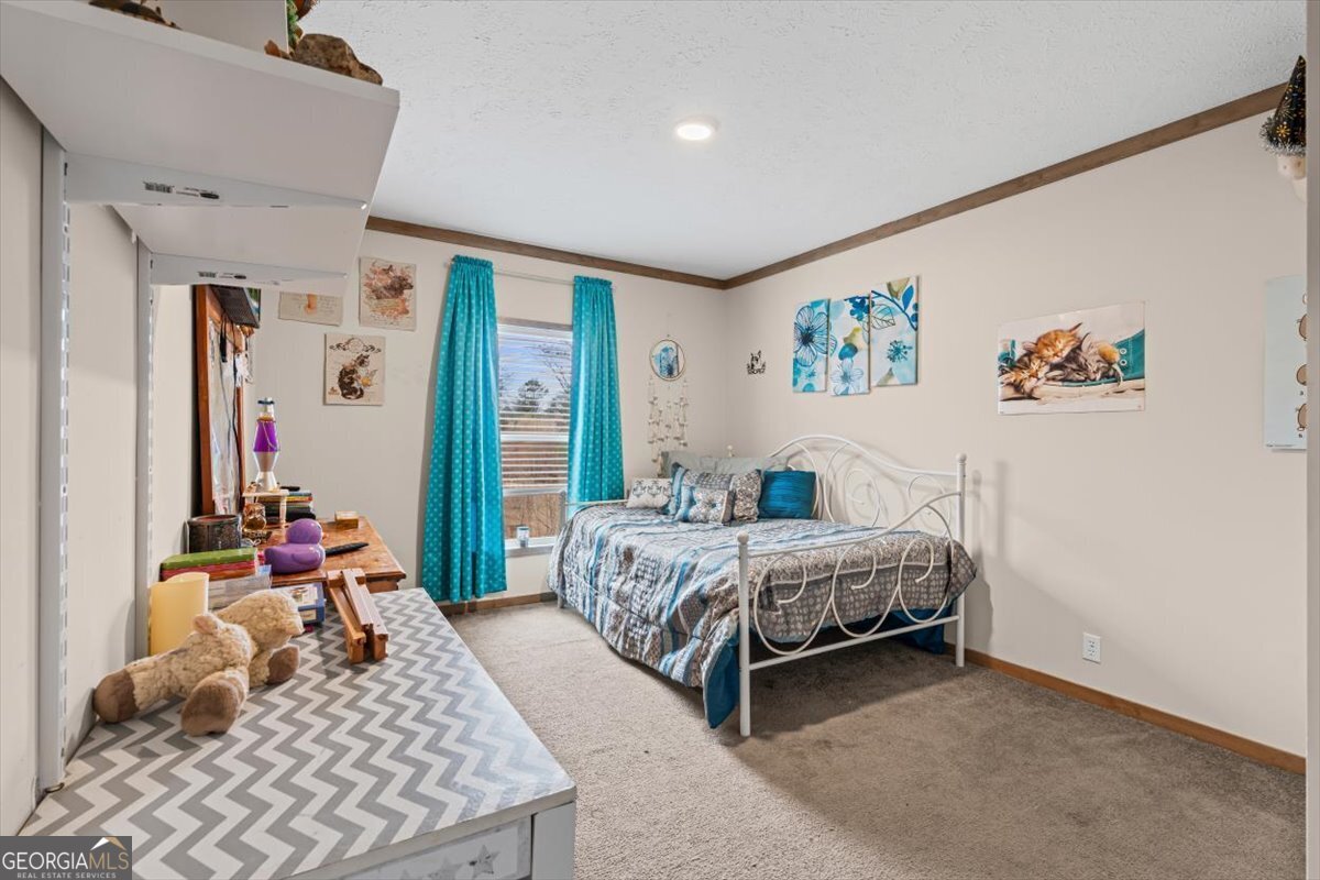 152 Campbell Road Cedartown, GA 30125 - Photo 32 of 42 a bedroom with a bed and a couch