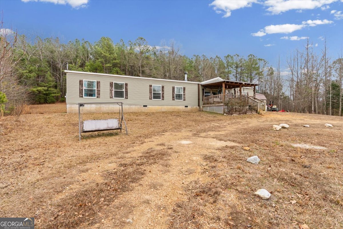 152 Campbell Road Cedartown, GA 30125 - Photo 5 of 42 a front view of a house with a yard and trees