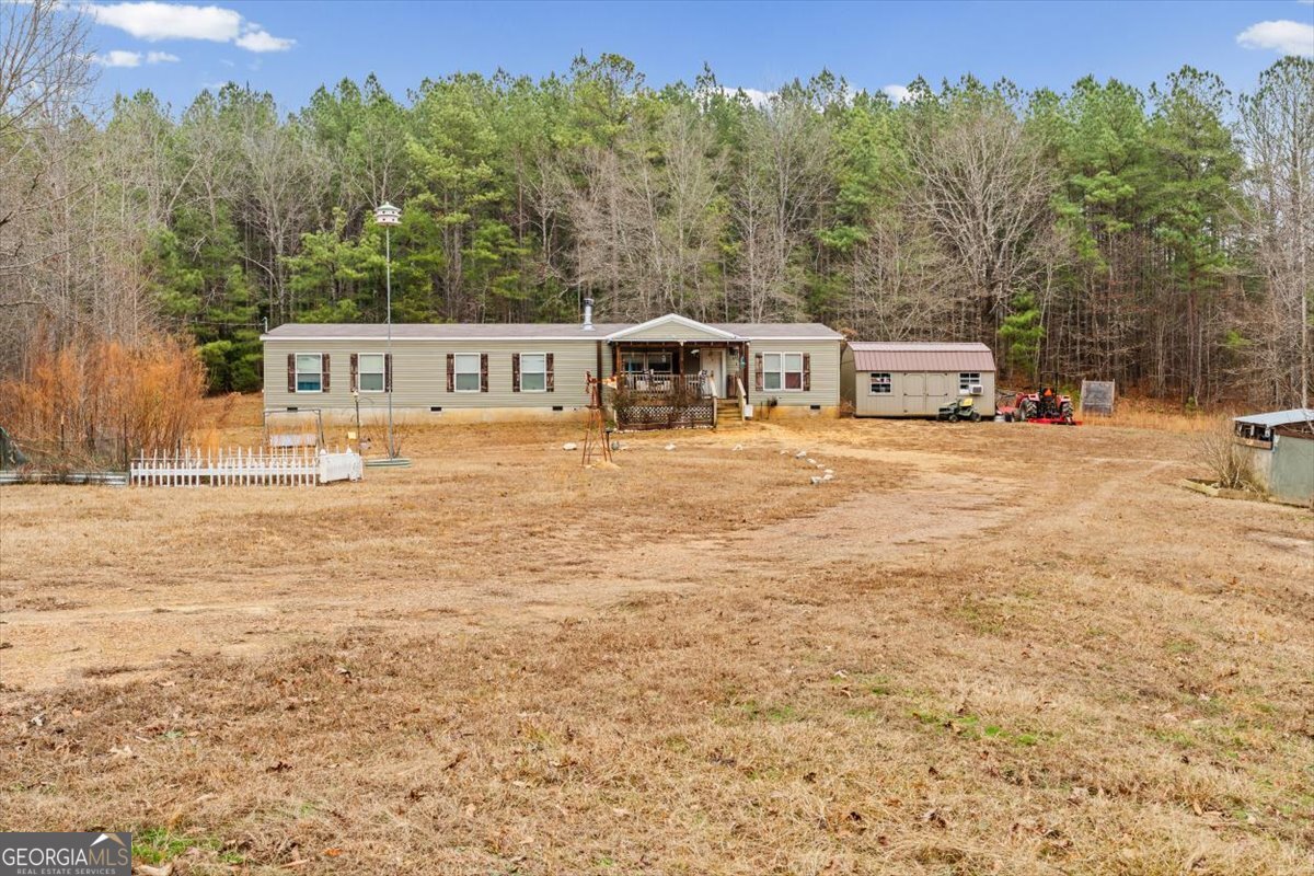 152 Campbell Road Cedartown, GA 30125 - Photo 6 of 42 a front view of a house with a yard and trees