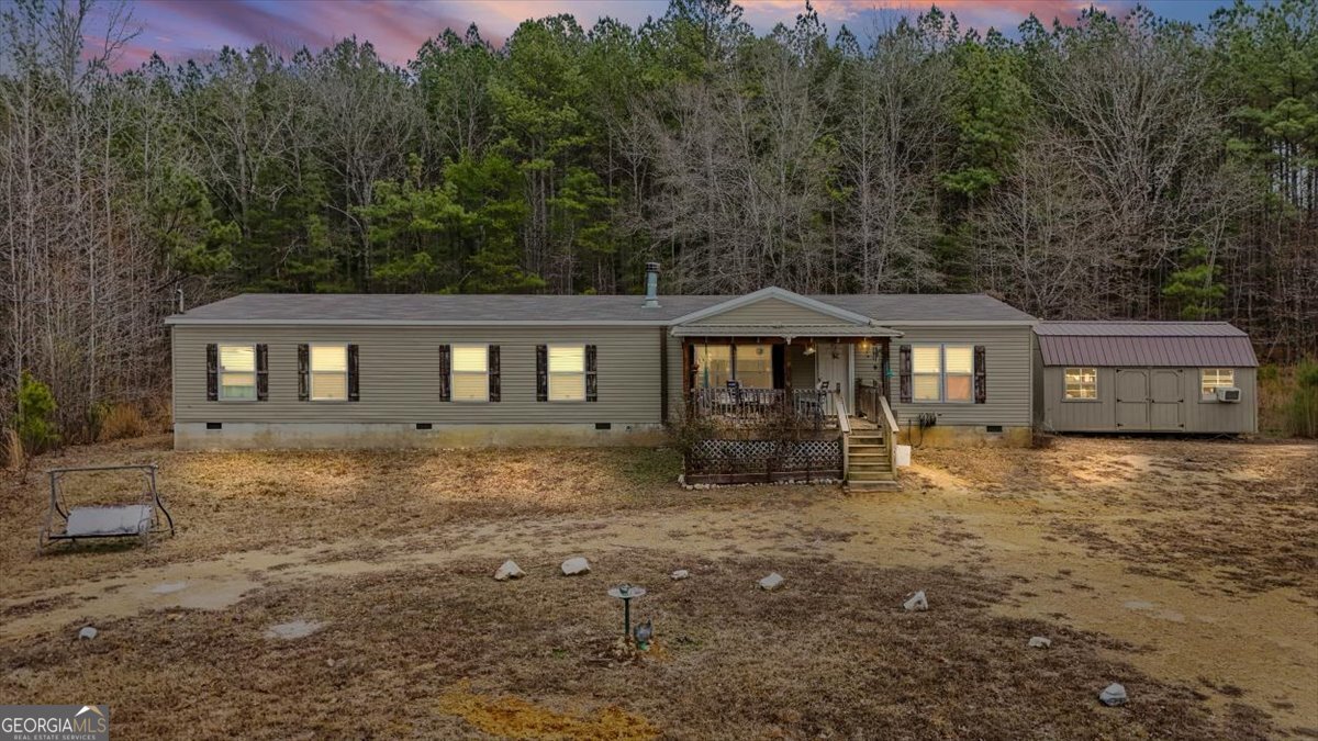152 Campbell Road Cedartown, GA 30125 - Photo 7 of 42 a view of a house with a yard and sitting area