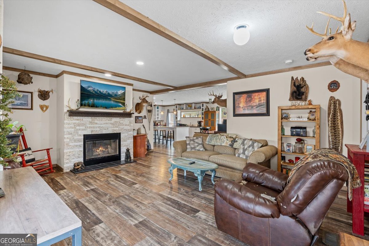 152 Campbell Road Cedartown, GA 30125 - Photo 9 of 42 a living room with furniture and a fireplace