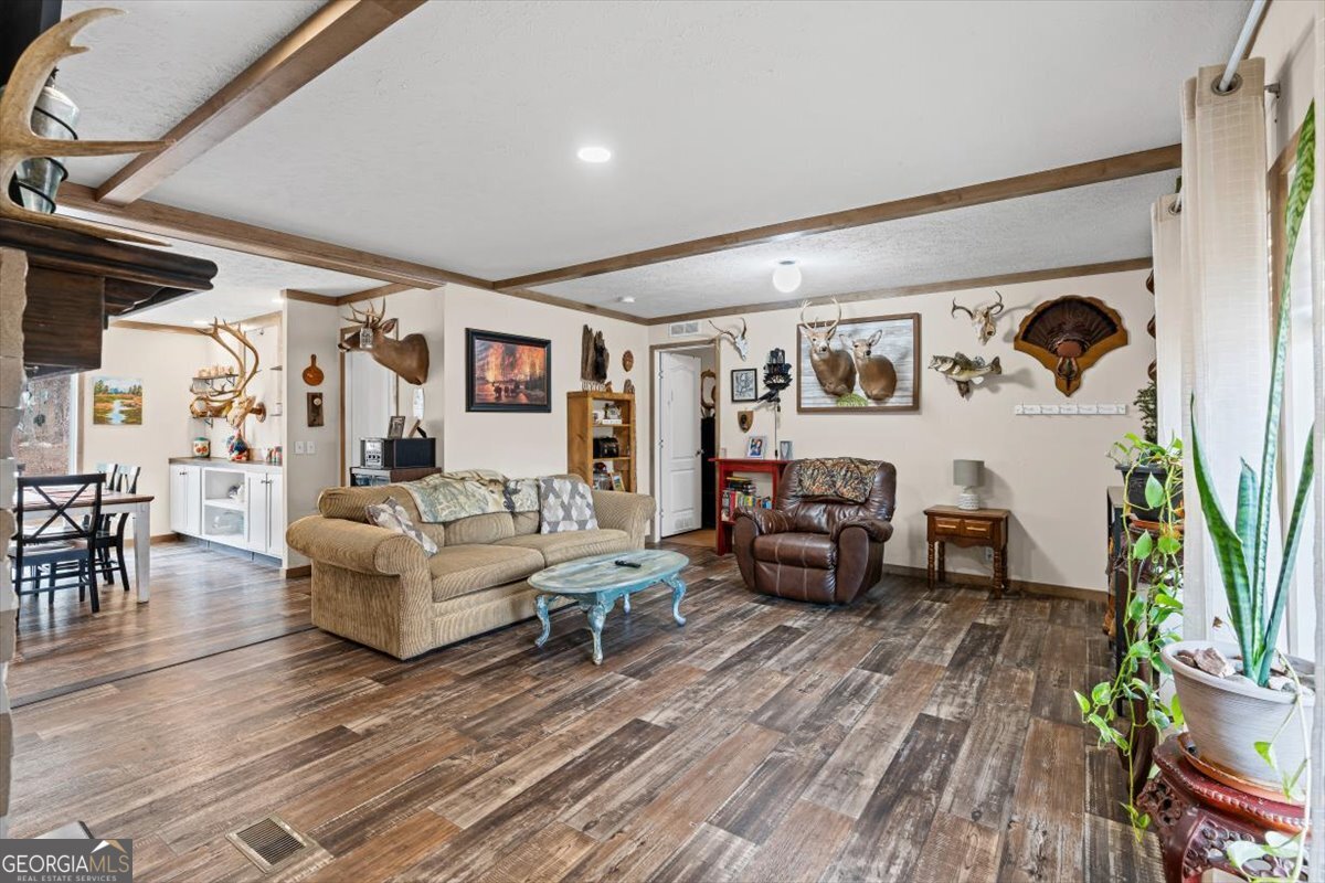 152 Campbell Road Cedartown, GA 30125 - Photo 10 of 42 a living room with furniture and a wooden floor