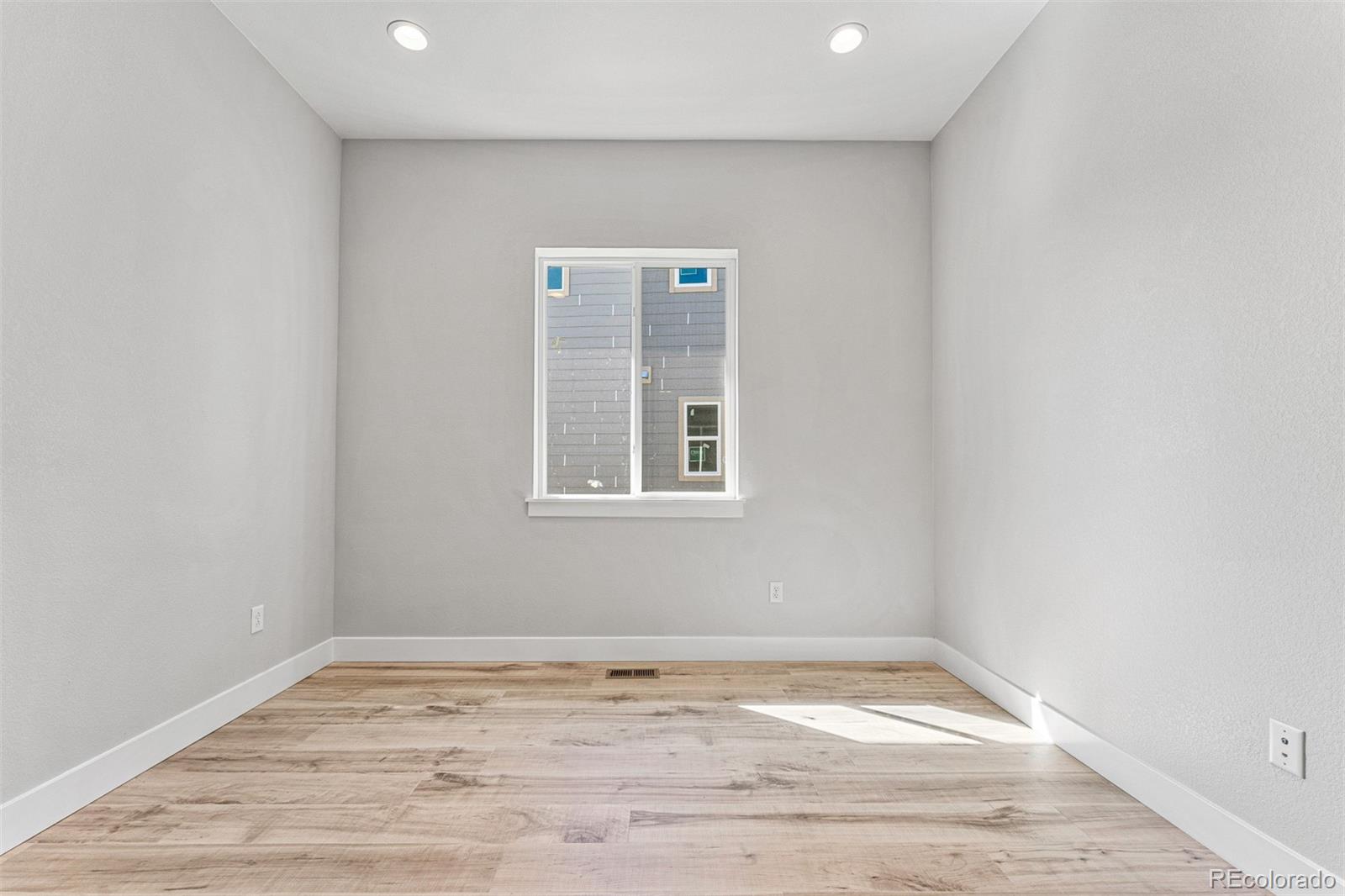 75 Clara Place Castle Pines, CO 80108 - Photo 23 of 39 a view of empty room with wooden floor and fan