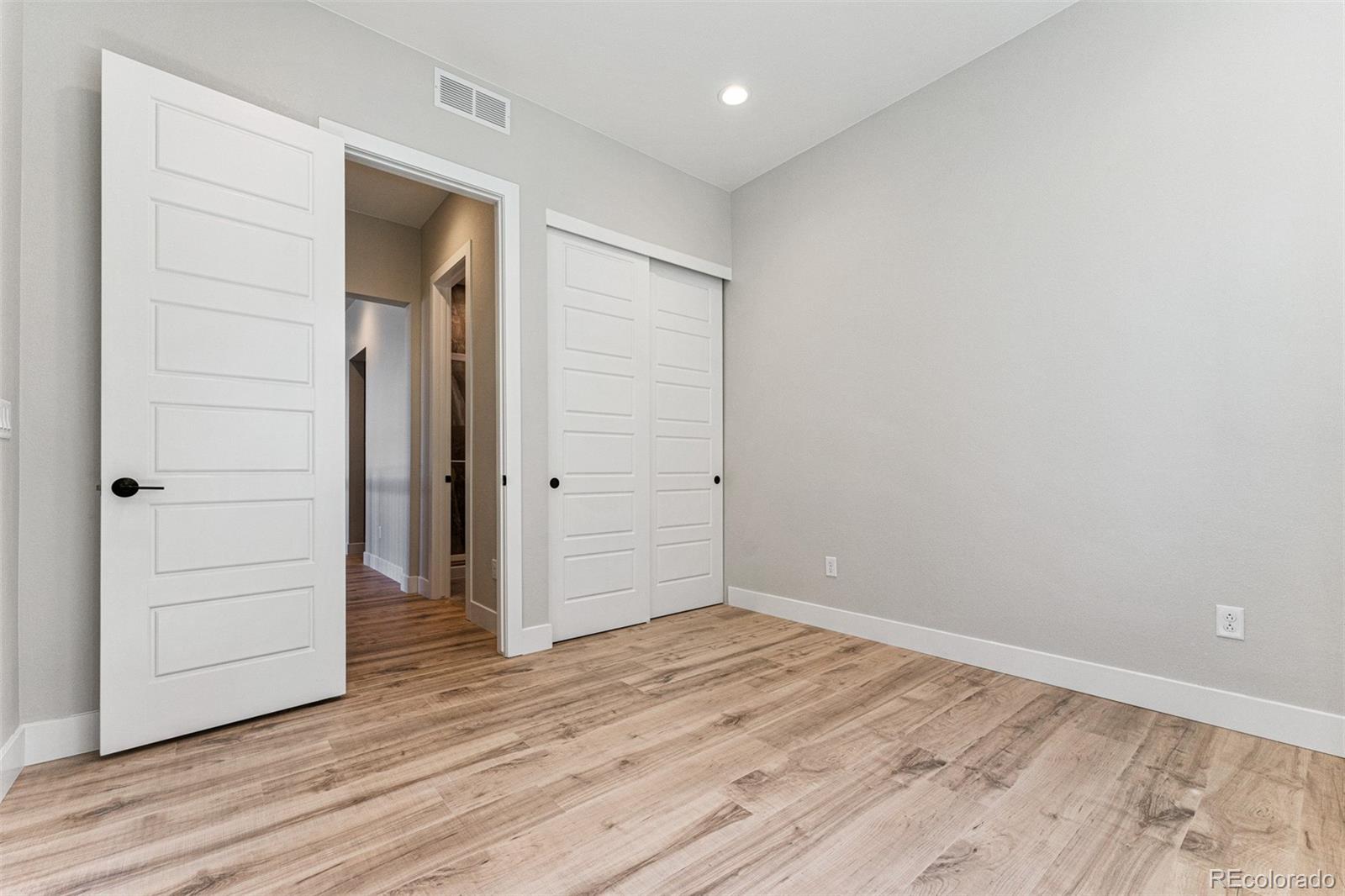 75 Clara Place Castle Pines, CO 80108 - Photo 24 of 39 wooden floor in an empty room