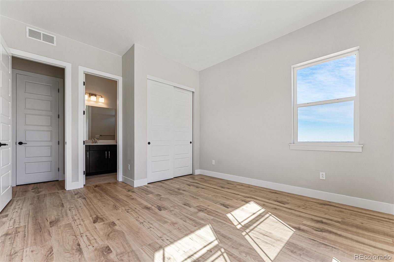 75 Clara Place Castle Pines, CO 80108 - Photo 28 of 39 a view of a room with wooden floor and closet