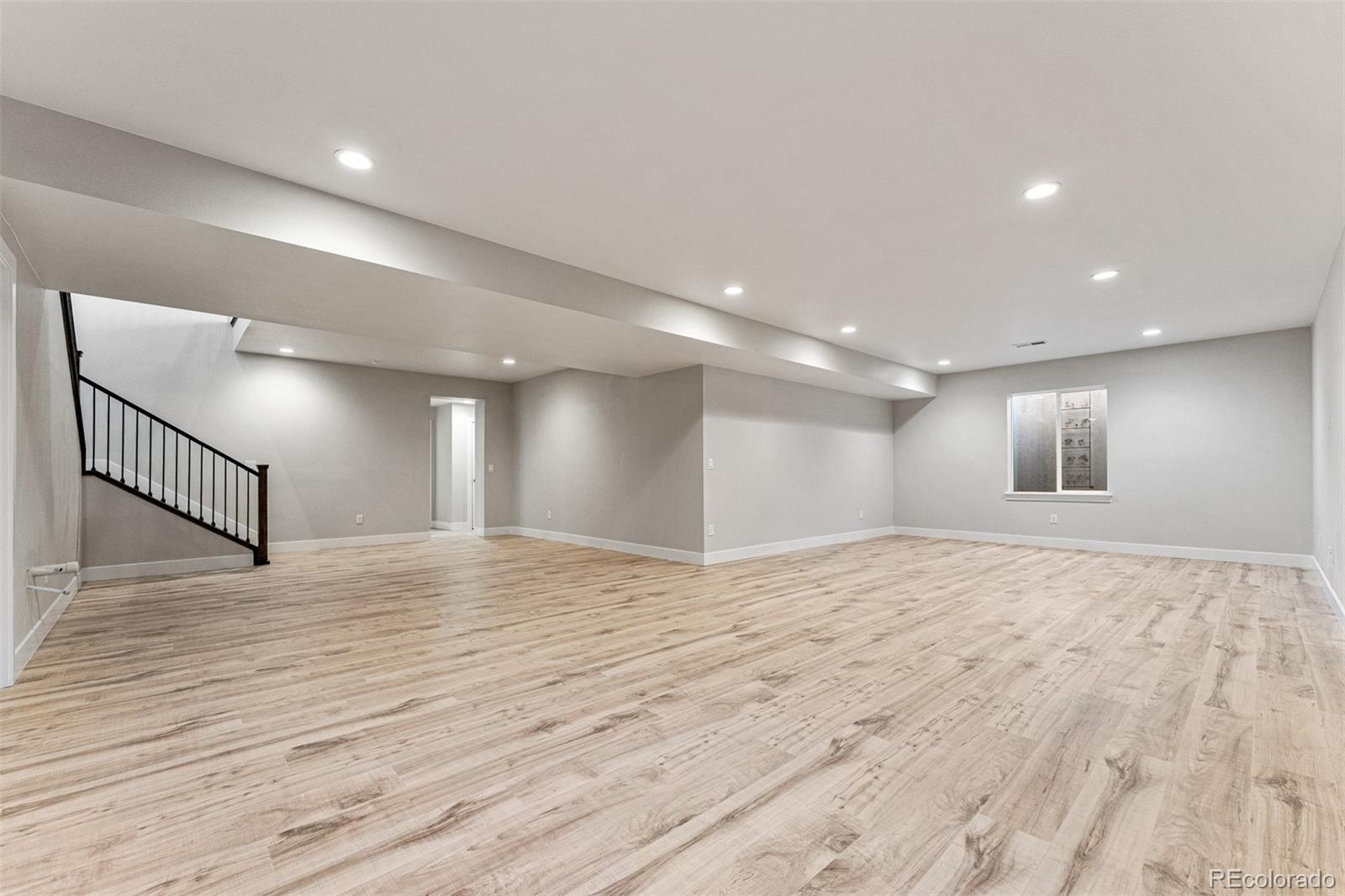 75 Clara Place Castle Pines, CO 80108 - Photo 31 of 39 a view of empty room with wooden floor