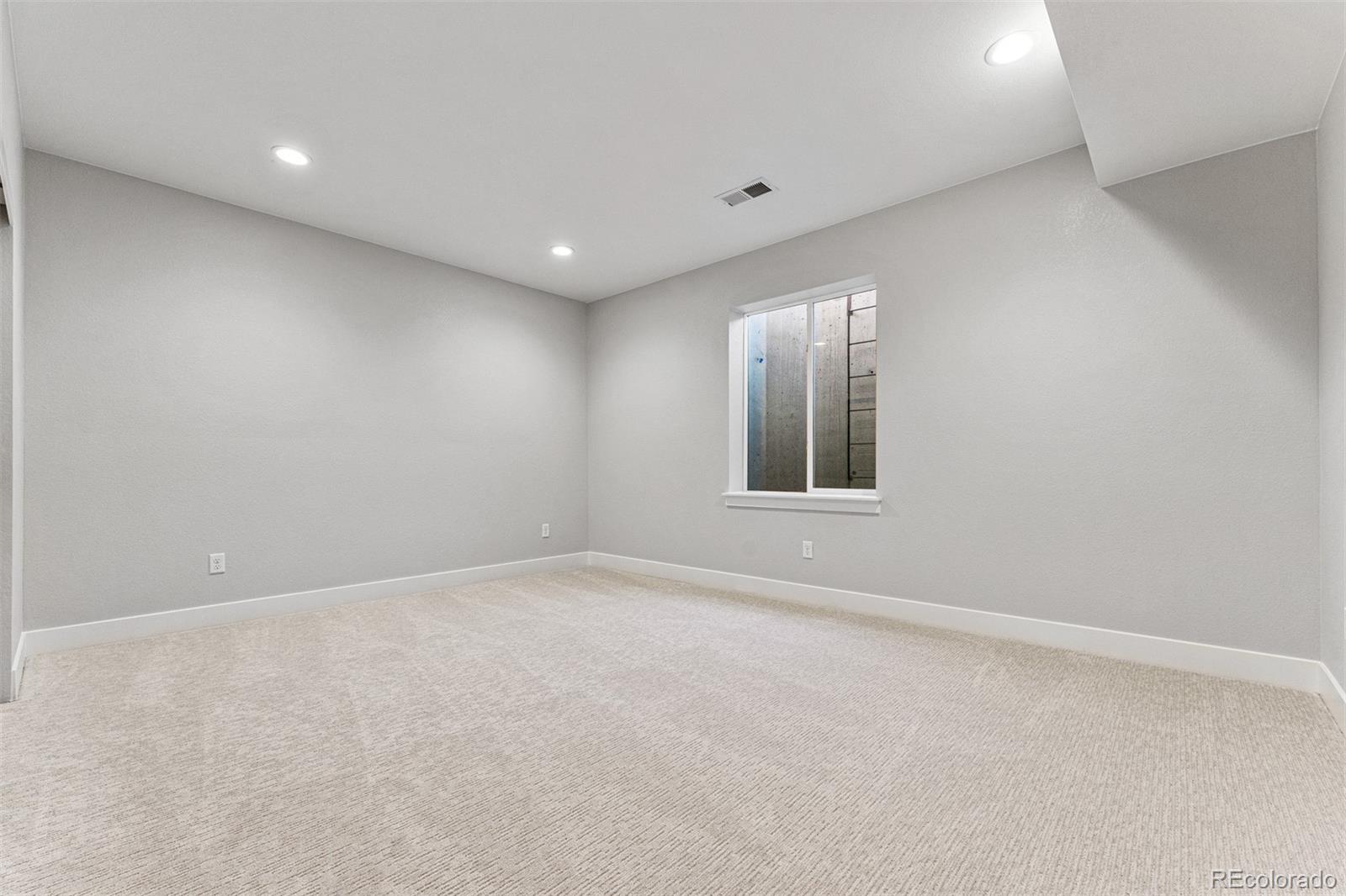 75 Clara Place Castle Pines, CO 80108 - Photo 32 of 39 a view of an empty room with a window