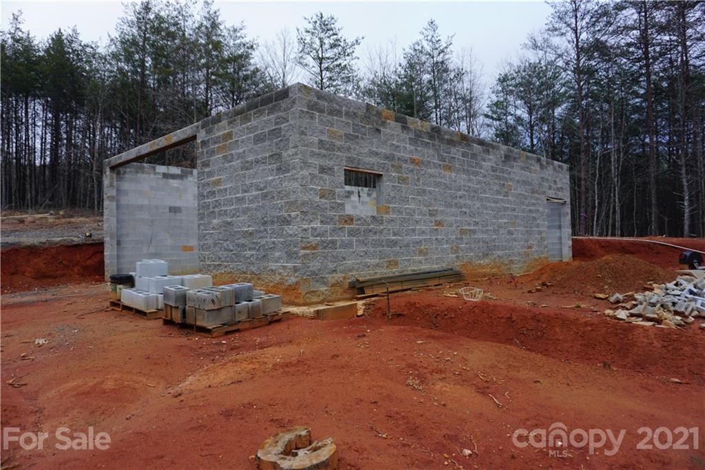 2312 Owl Hollow Road Mill Spring, NC 28756 - Photo 3 of 22 a backyard of a house with lots of green space