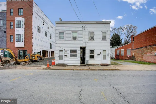 a view of a street with a building