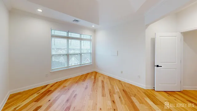 a view of kitchen and dining room with windows