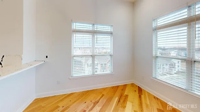 a kitchen with a refrigerator sink and cabinets