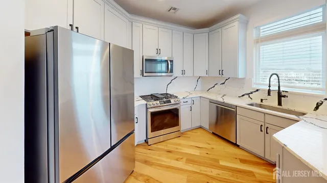 a spacious bedroom with a bed and a window