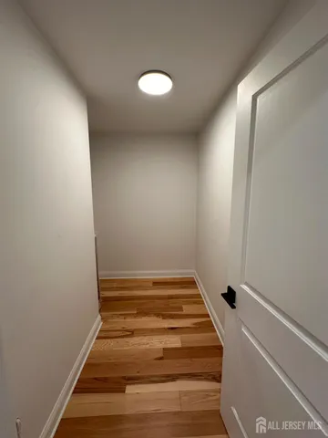 a view of a hallway with stairs