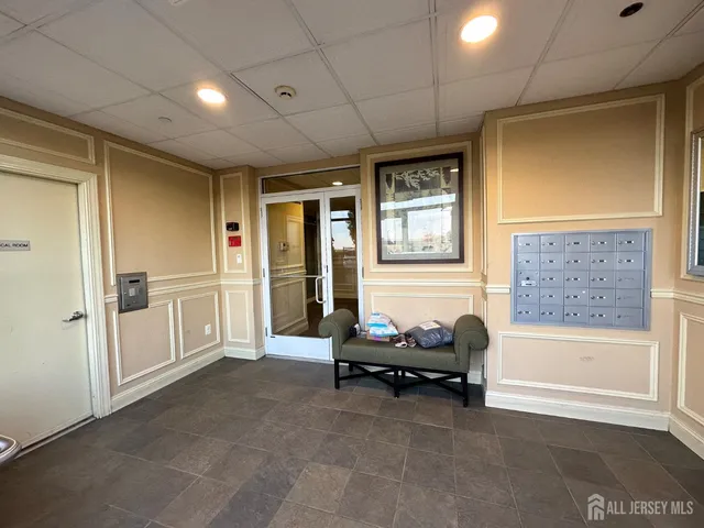 an aerial view of multiple houses with a yard