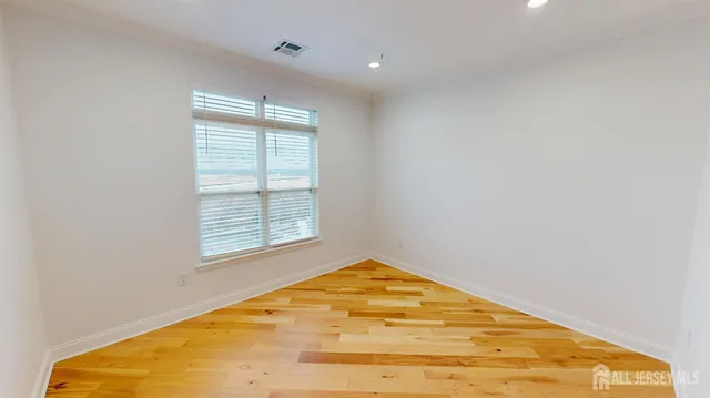 a bathroom with a sink mirror vanity and toilet