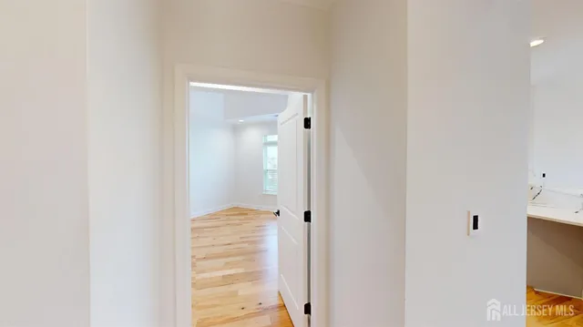 a en suite bathroom with a granite countertop sink