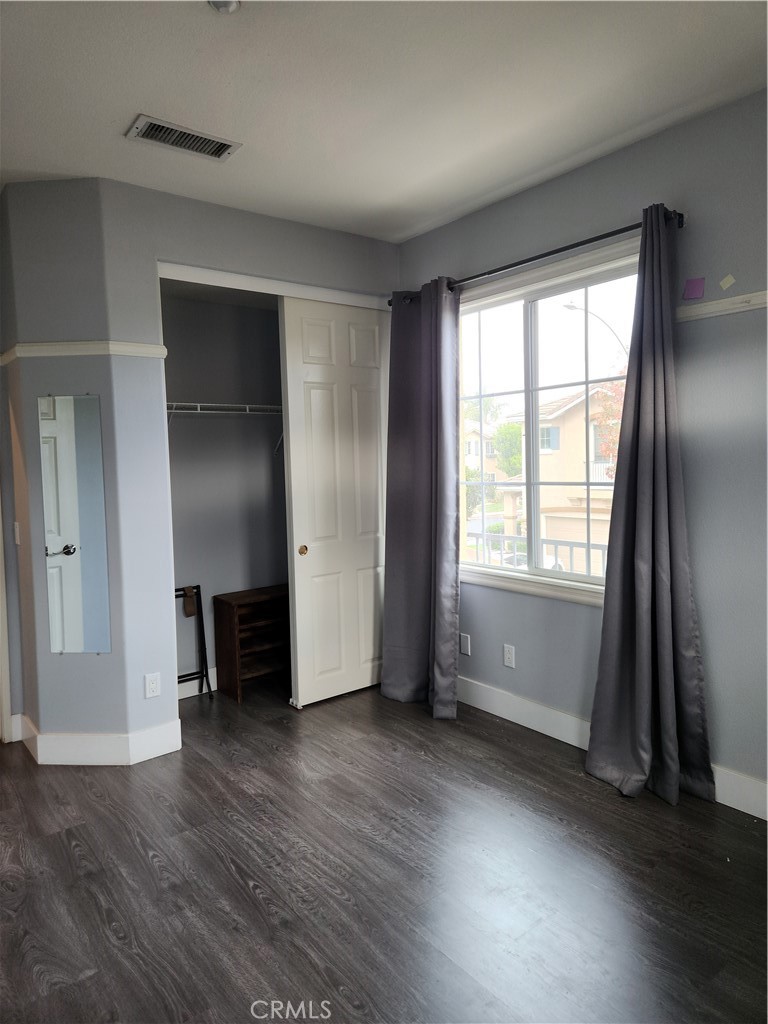 4540 Springleaf Lane Riverside, CA 92505 - Photo 14 of 32 an empty room with wooden floor and a window