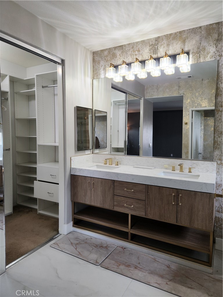 4540 Springleaf Lane Riverside, CA 92505 - Photo 29 of 32 a bathroom with a sink double vanity and a large mirror