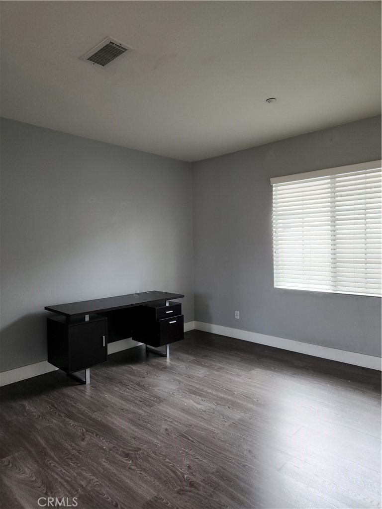 4540 Springleaf Lane Riverside, CA 92505 - Photo 30 of 32 a view of room with window and a ceiling fan