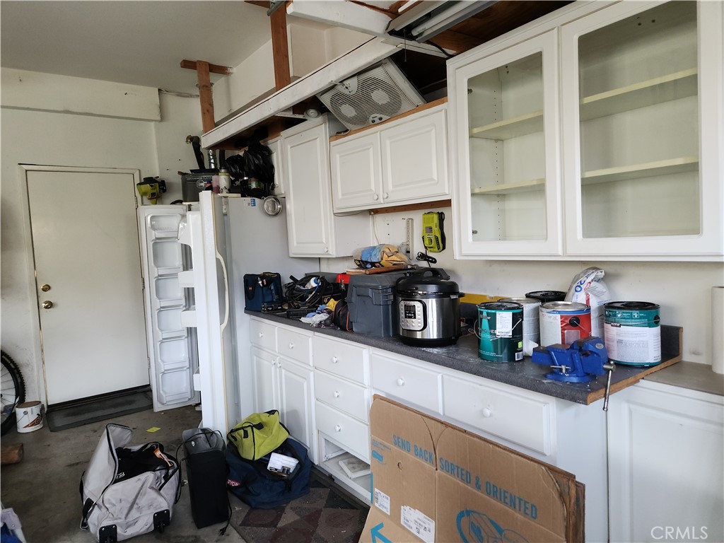 4540 Springleaf Lane Riverside, CA 92505 - Photo 31 of 32 a kitchen with stainless steel appliances granite countertop a refrigerator and a counter top space