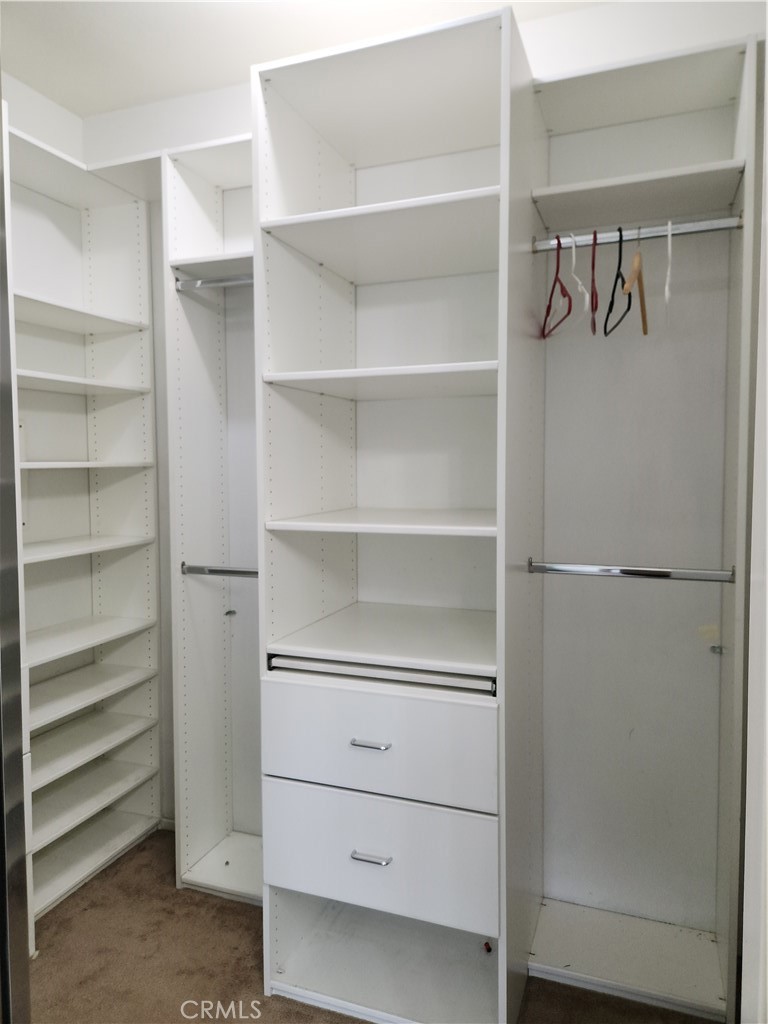 4540 Springleaf Lane Riverside, CA 92505 - Photo 10 of 32 a view of walk in closet with empty racks
