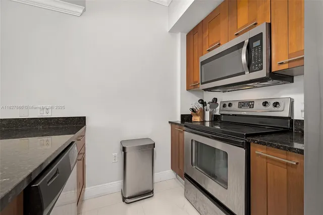 a kitchen with a stove and a microwave