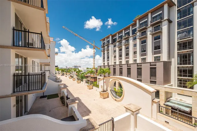 a view of a balcony dining table and chairs