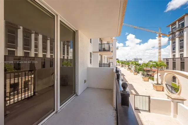 a view of a kitchen with a sink and dishwasher a refrigerator with wooden floor