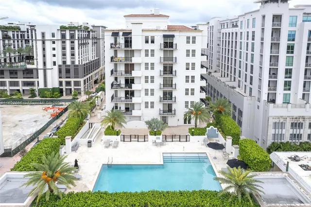 a view of buildings with yard