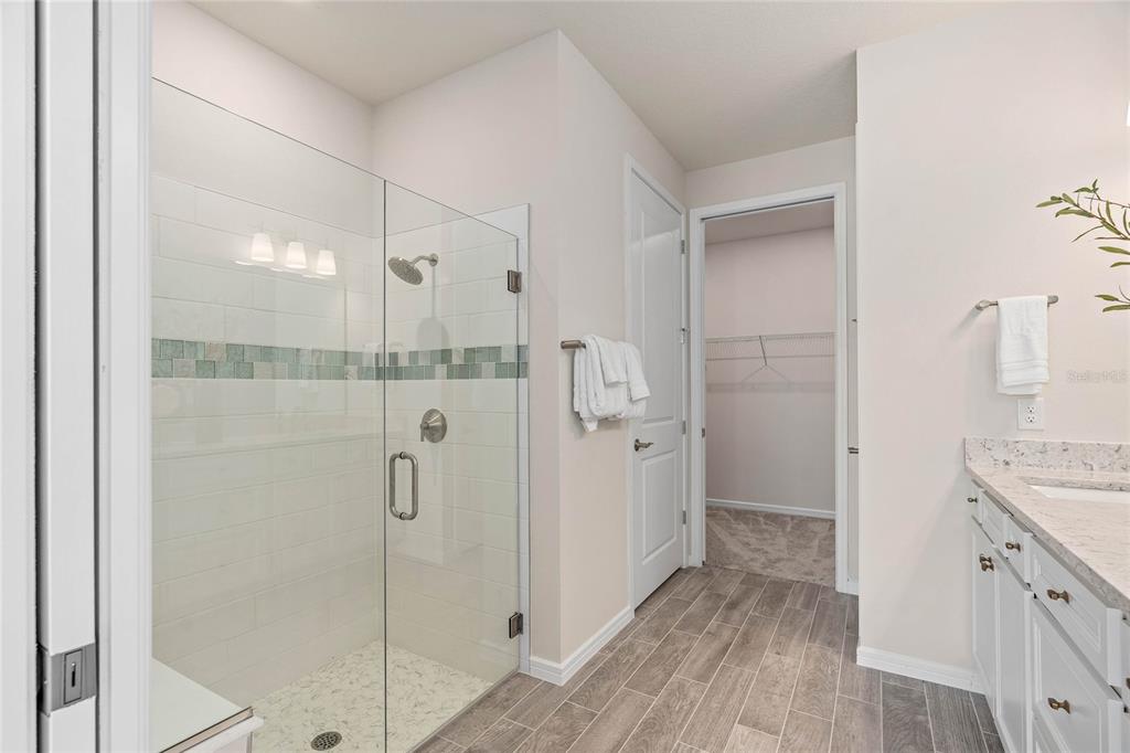6300 Dew Drop Loop St. Cloud, FL 34771 - Photo 16 of 29 a bathroom with a shower and a sink