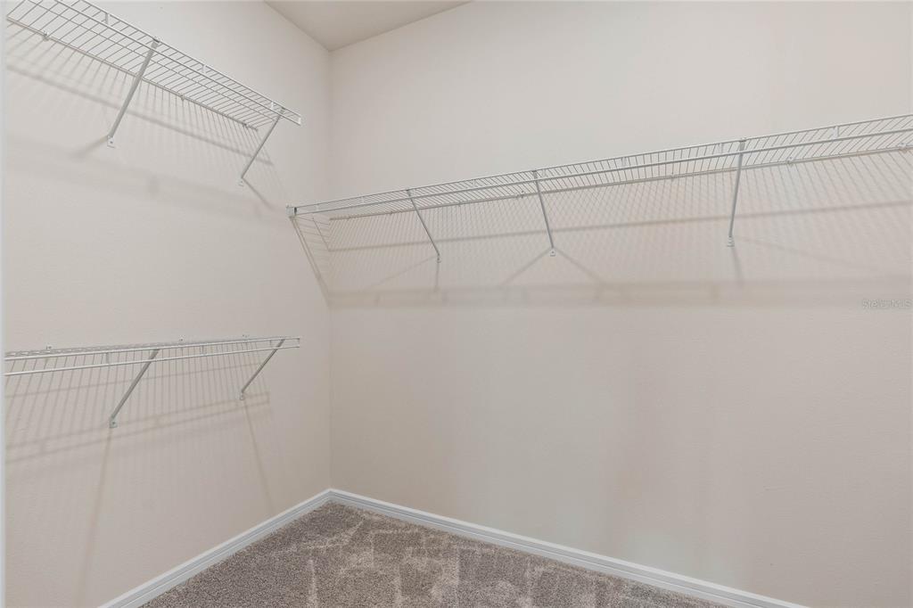 6300 Dew Drop Loop St. Cloud, FL 34771 - Photo 20 of 29 a view of a room with racks on the wall