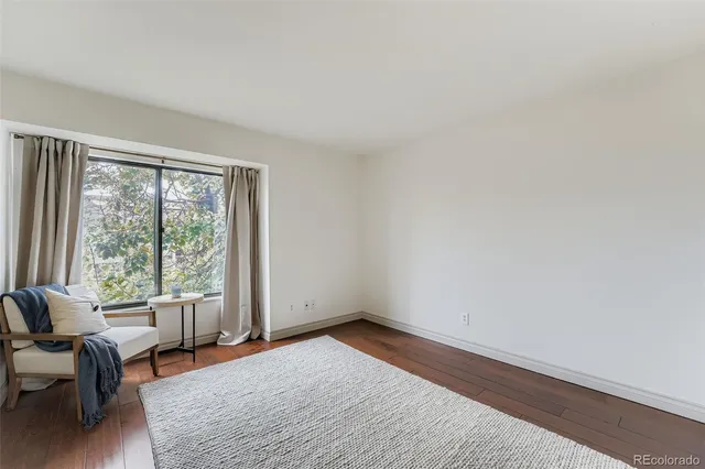 a view of a livingroom with a couch and a window