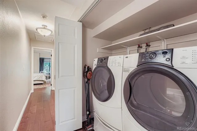a view of a hallway with washer and dryer