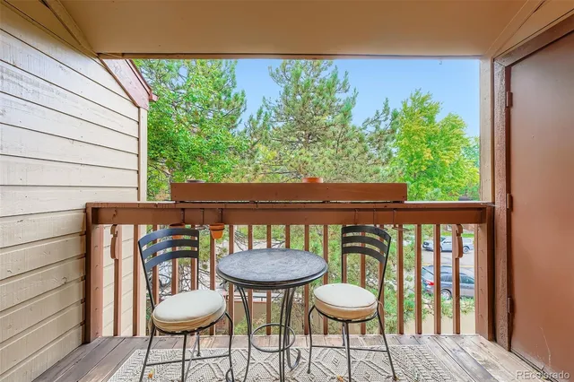 a view of a chairs and table in patio