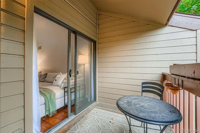 a balcony view with a couple of chairs