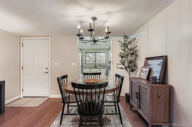 a view of a dining room with furniture and window