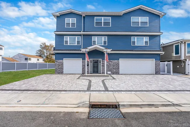 a front view of a house with yard