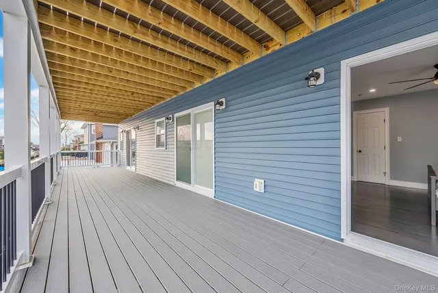 a view of balcony with wooden floor