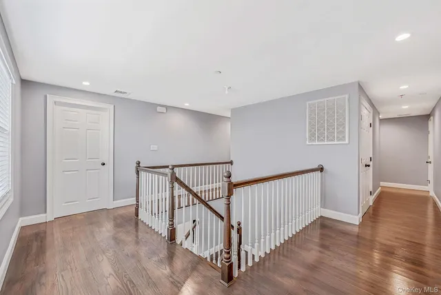 a spacious bedroom with a bed and a view of walk in closet