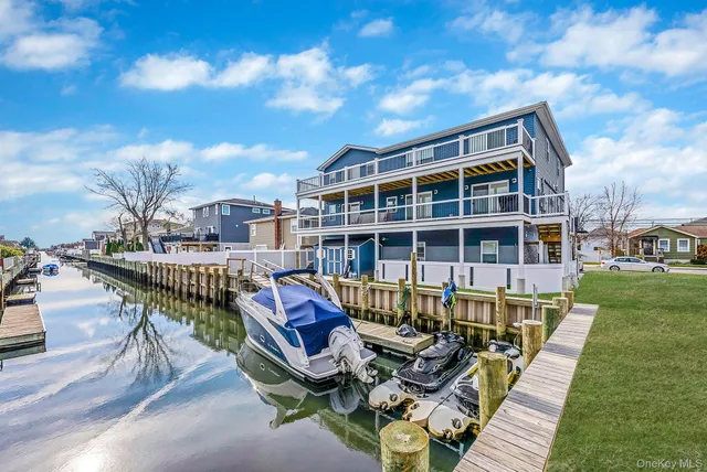 a view of a house with backyard and deck