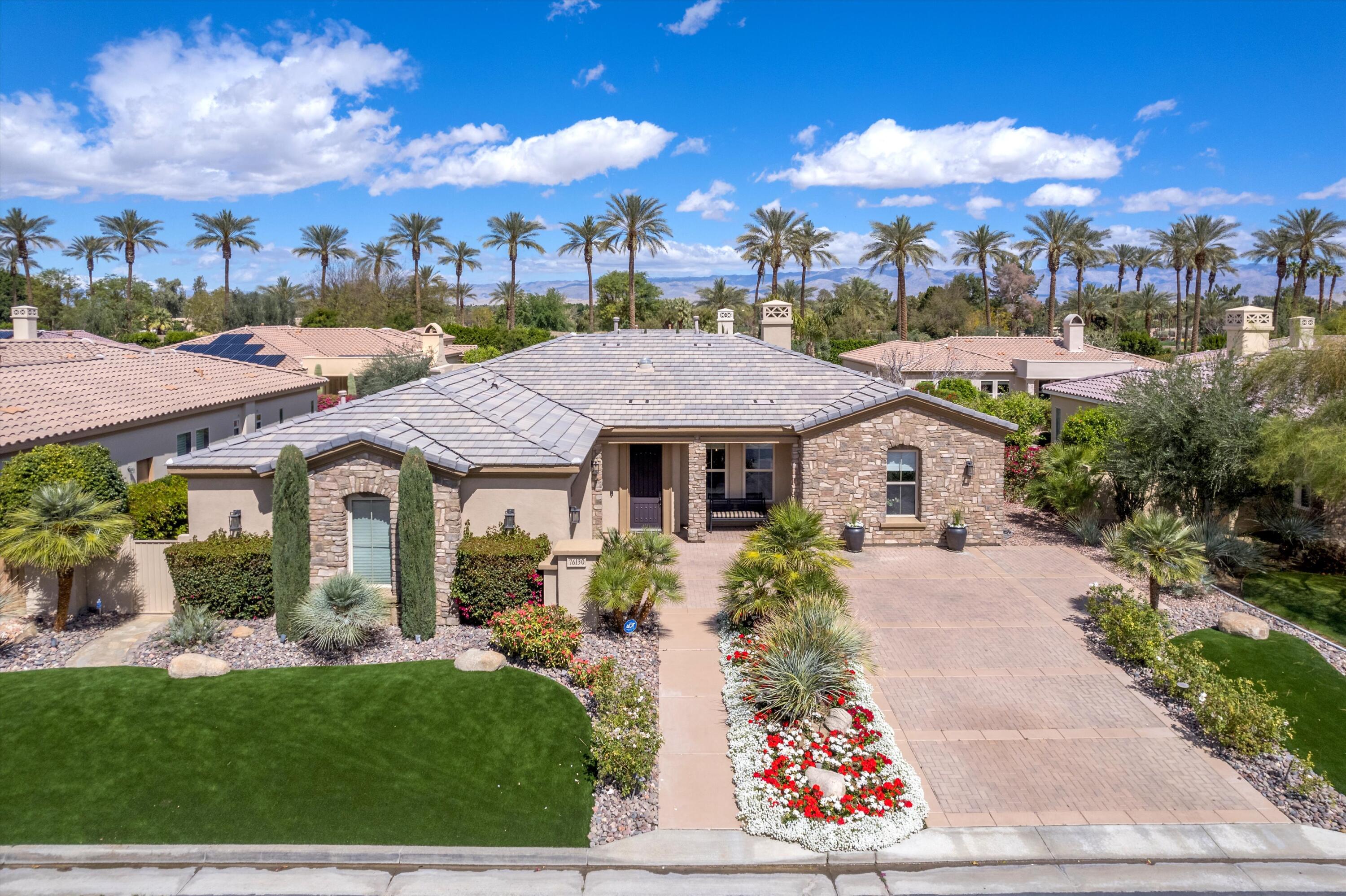 76130 Via Montelena Indian Wells, CA 92210 - Photo 1 of 33 a front view of a house with garden