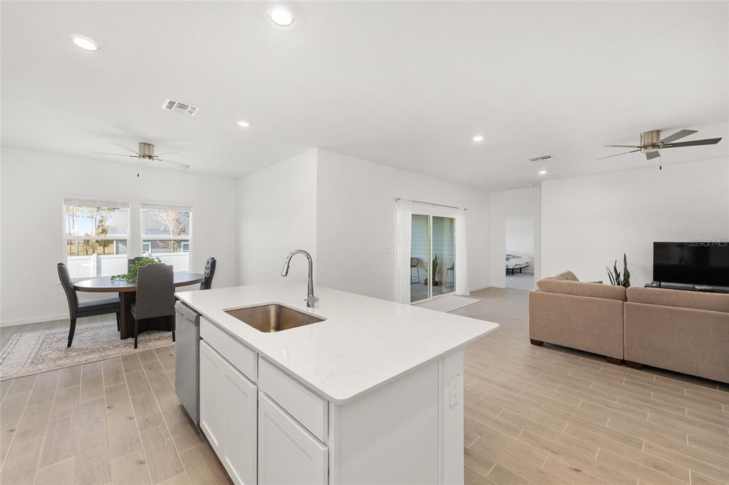 8972 Southwest 69th Terrace Ocala, FL 34476 - Photo 13 of 42 a living room with furniture and a flat screen tv