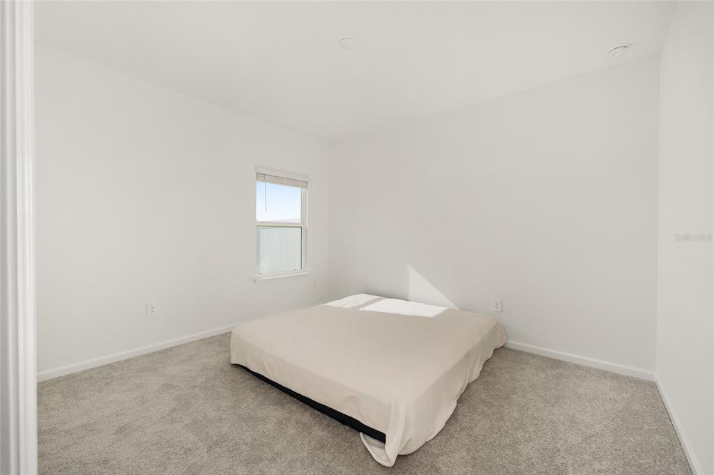 8972 Southwest 69th Terrace Ocala, FL 34476 - Photo 26 of 42 a utility room with a bed and a window