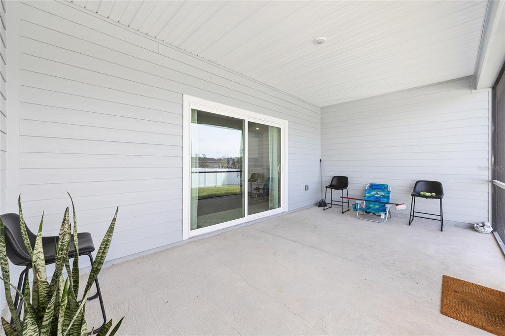 8972 Southwest 69th Terrace Ocala, FL 34476 - Photo 32 of 42 a view of a livingroom with chairs and lounge chair