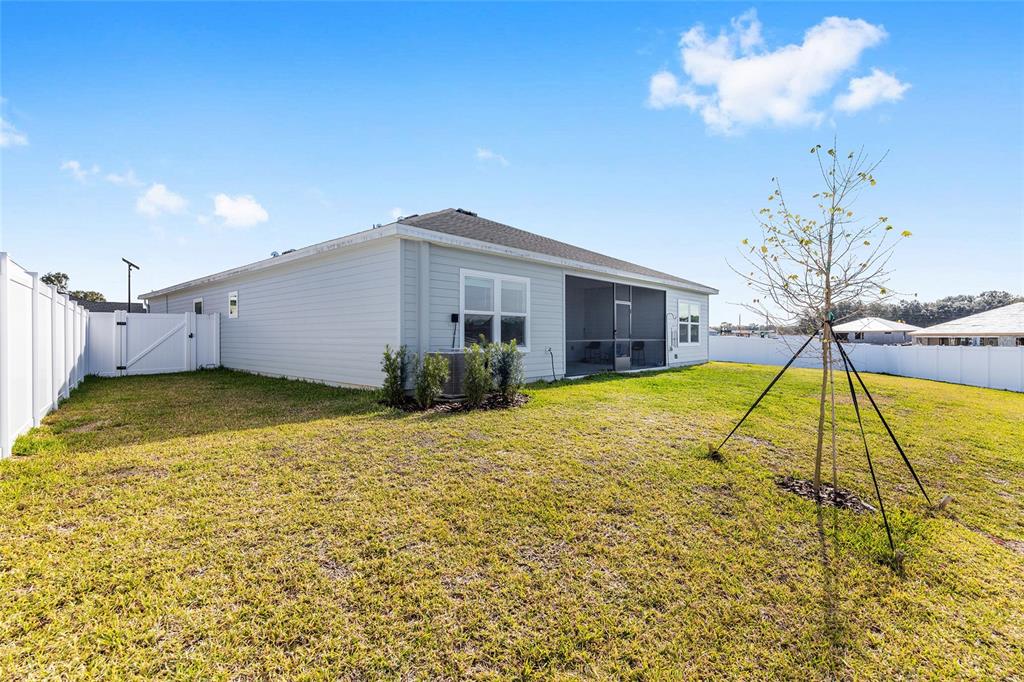 8972 Southwest 69th Terrace Ocala, FL 34476 - Photo 35 of 42 a view of a house with a swimming pool
