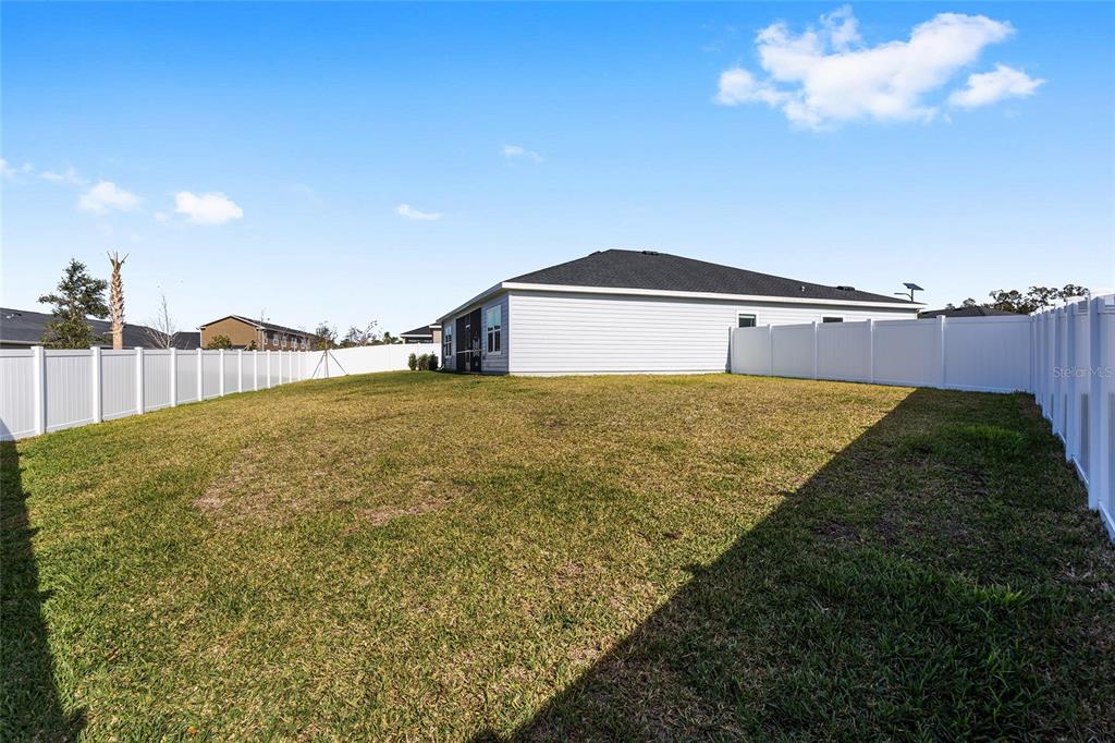 8972 Southwest 69th Terrace Ocala, FL 34476 - Photo 36 of 42 a view of a house with a yard