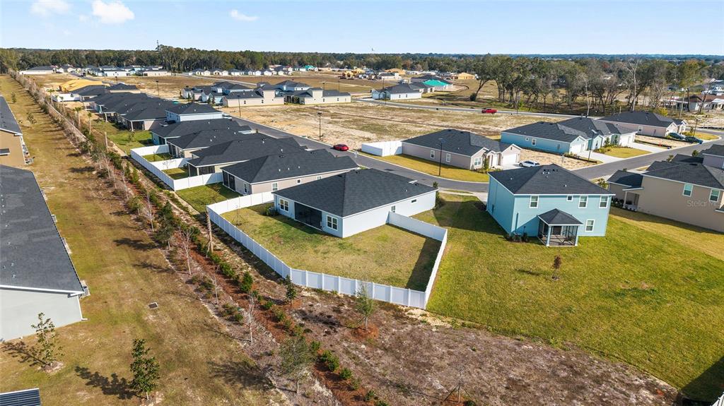 8972 Southwest 69th Terrace Ocala, FL 34476 - Photo 41 of 42 an aerial view of residential houses with outdoor space